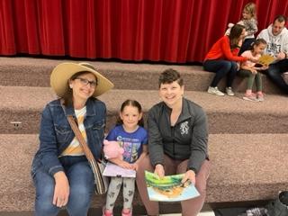 Kindergarten student with guardians at the Teddy Bear Picnic