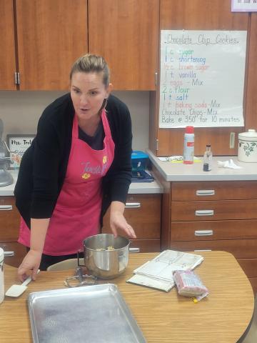 Mrs. Toelupe showing off her cooking skills