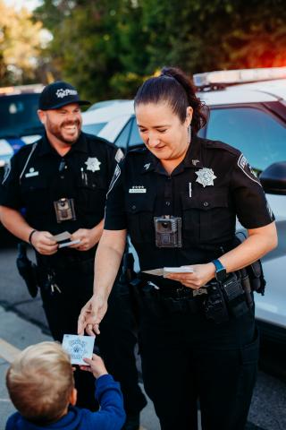 Payson city officers passing out stickers