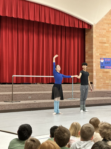 Ballet West performers teaching Park View students how they warm up 