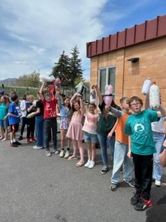 5th graders showing off their rockets stuffed with eggs